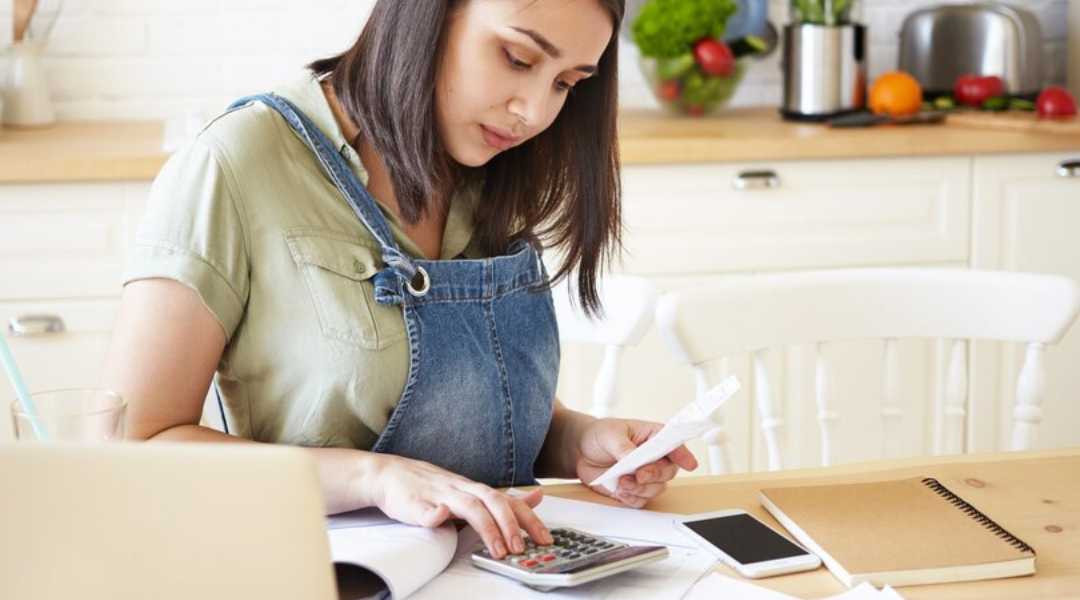 A woman paying her air conditioner bill.